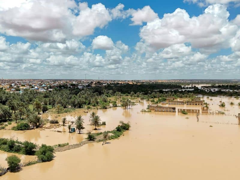 Flooded residential and agricultural property illustrating why elevation certificates and LiDAR mapping are important in flood-prone areas